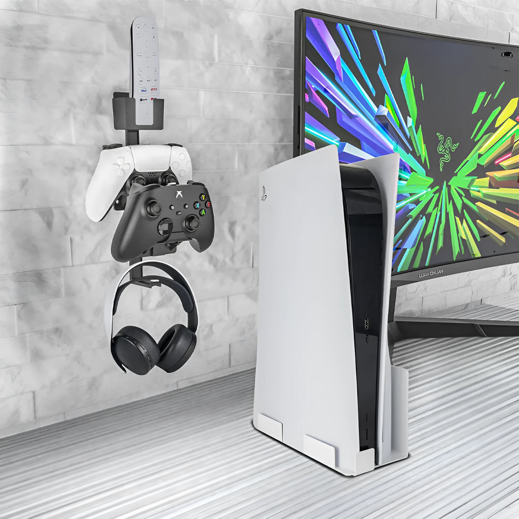 White wall-mounted plastic hook holding a game controller and a pair of headphones.