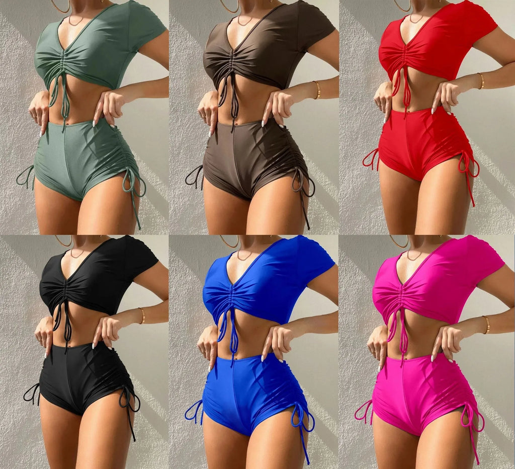 Women's lace-up bow swimsuit top with matching shorts in dark green.