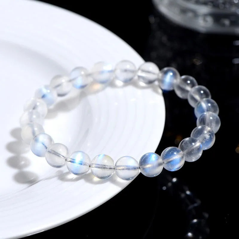 Natural cream body crystal bracelet with blue moonlight design showing minimalist unisex style