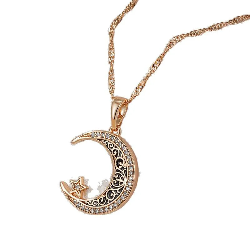 Rose gold star and moon zircon pendant necklace with enamel detail on a water wave chain.