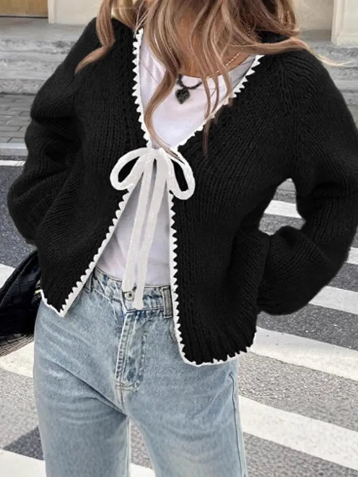 Women's gray loose-fit cardigan with crocheted flower detail on the front
