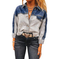 Women's loose blue denim coat with a row of silver buckle closures down the front.