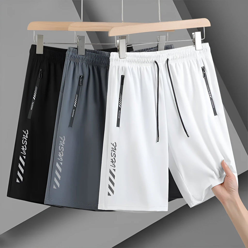 Men's quick-drying nylon sports shorts in loose fit with elastic waistband