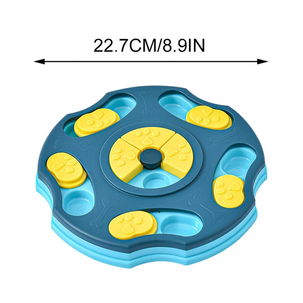 Blue and pink dog puzzle toy feeder bowl for aggressive chewers on a wooden floor.