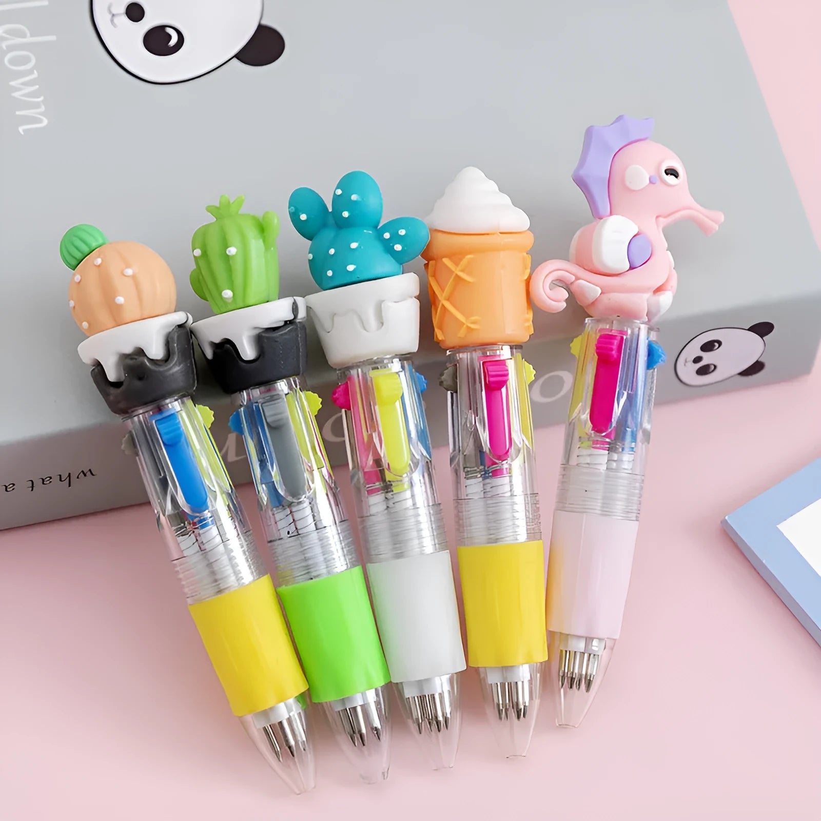 Four-colour press ballpoint pen with cartoon designs and 0.7mm tip in random colour pattern options