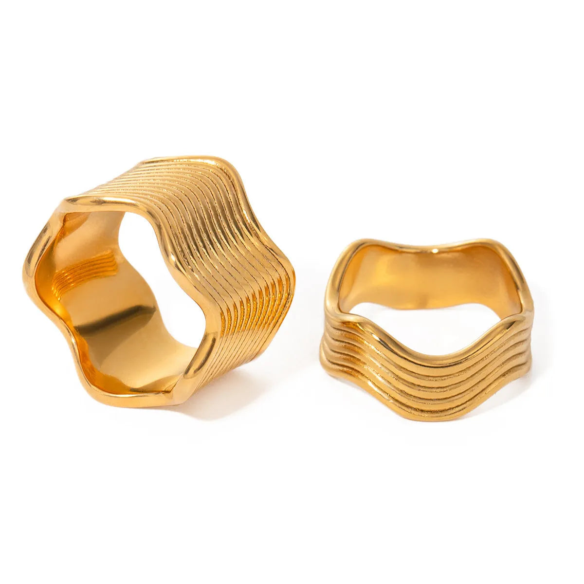 Stainless steel wide wave ring with geometric design and electroplated finish.