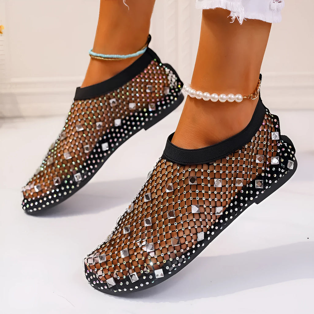 Colourful rhinestone detail on the mesh upper of women's white flat sandals with a round toe.