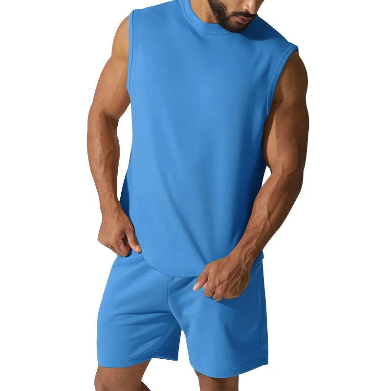 Men's sleeveless cotton blend sports suit with matching shorts in a solid colour.
