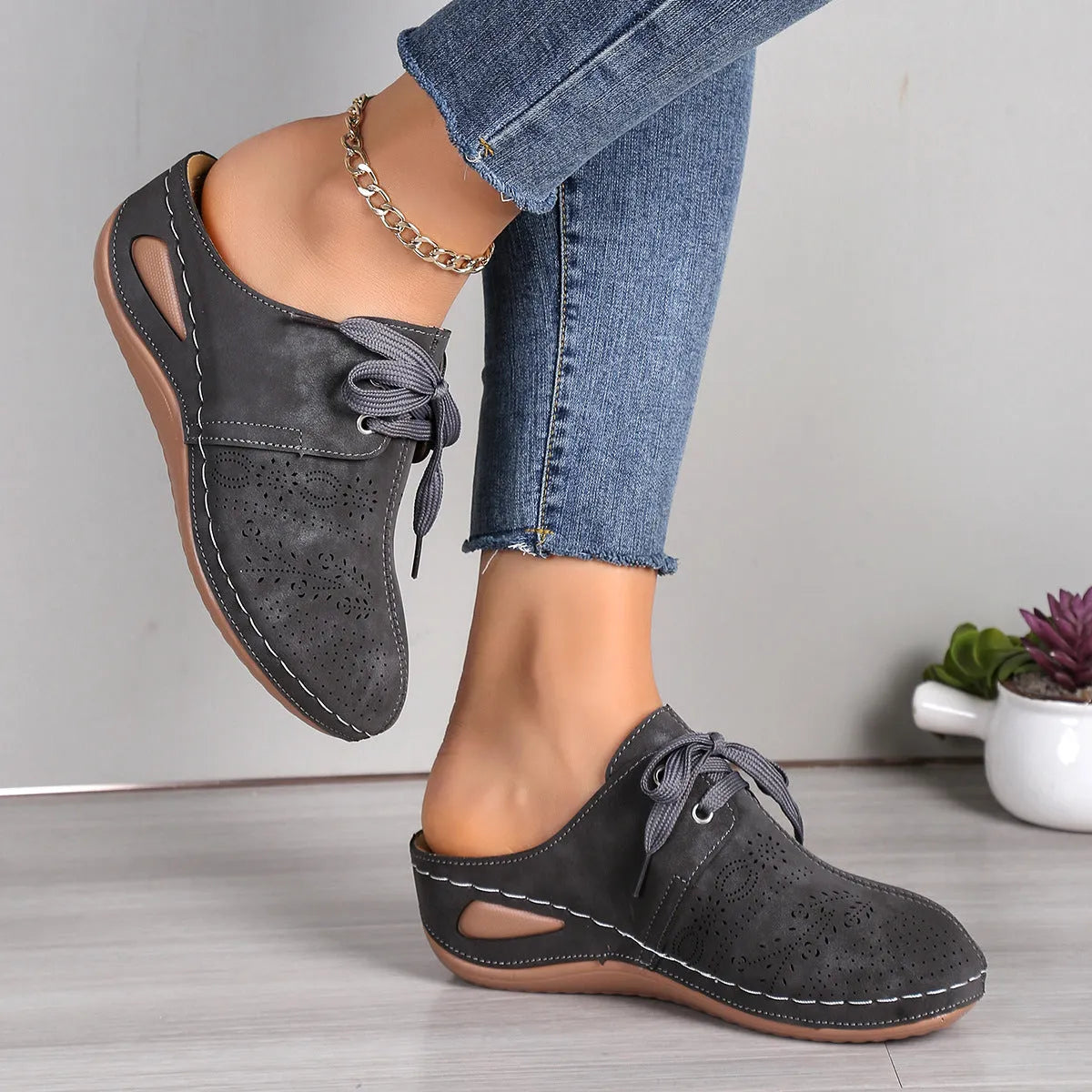 Women's baotou lace-up slippers with hollow-out wedge design in suede and rubber construction