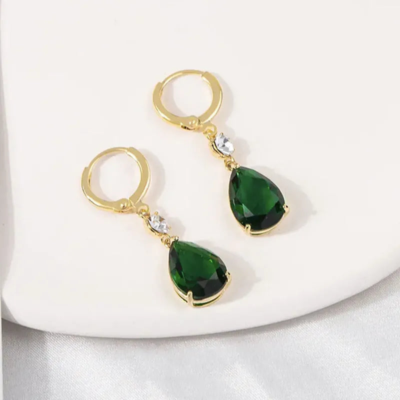 A pair of green geometric teardrop-shaped alloy earrings.