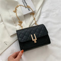 Women's black PU leather crossbody bag with diamond lattice chain detailing and adjustable shoulder strap