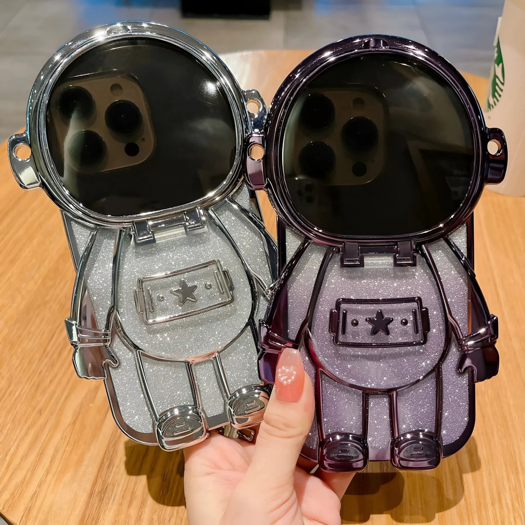 Electroplated TPU astronaut phone case for iPhone 14 Pro Max in pink with mirror finish, bracket, and lanyard.