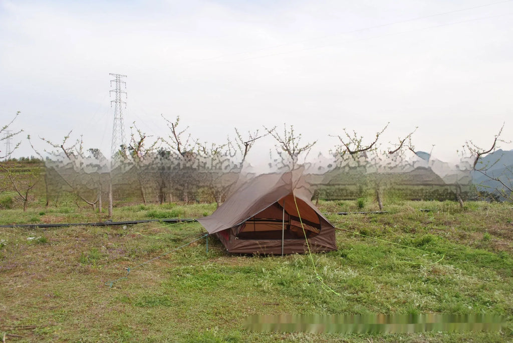 Brown A-line pole-free cabin tent set up with hiking poles showing spacious interior for 2-3 campers