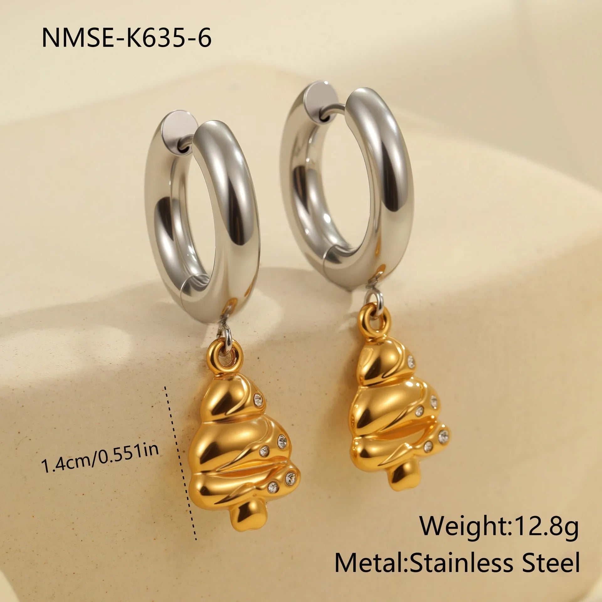 Christmas tree heart earrings in stainless steel with 18K gold plating showing star and geometric shapes