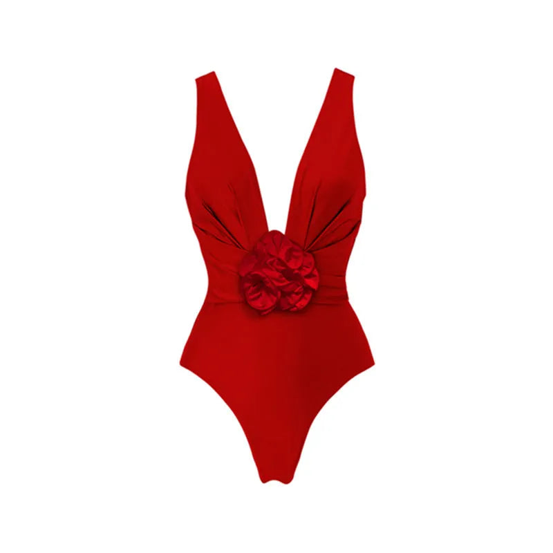 Red floral women's one-piece swimsuit with V-neck, open back, and detachable skirt