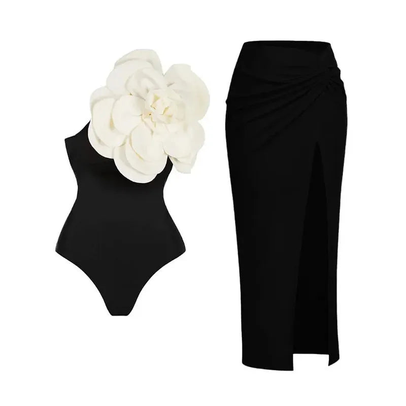 Women's one-piece swimsuit with three-dimensional floral design on black fabric.