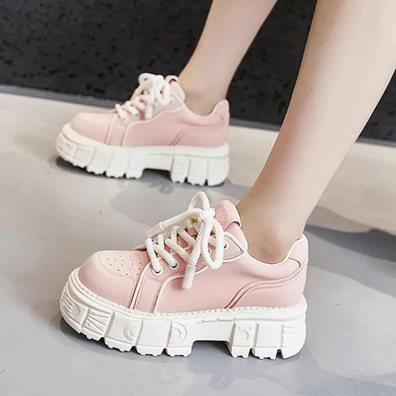 Women's beige casual leather shoes with a spring muffin heel on a rubber foam sole.