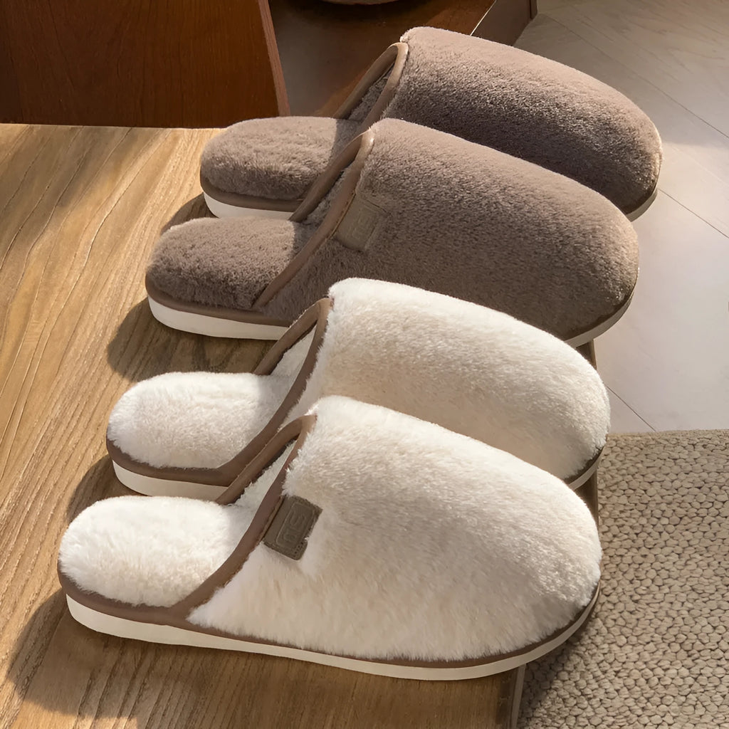 A pair of solid colour plush winter slippers with a non-slip PVC sole, shown in available colours.