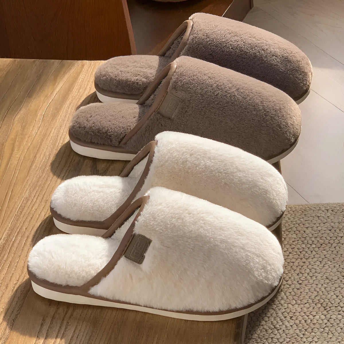 A pair of solid colour plush winter slippers with a non-slip PVC sole, shown in available colours.