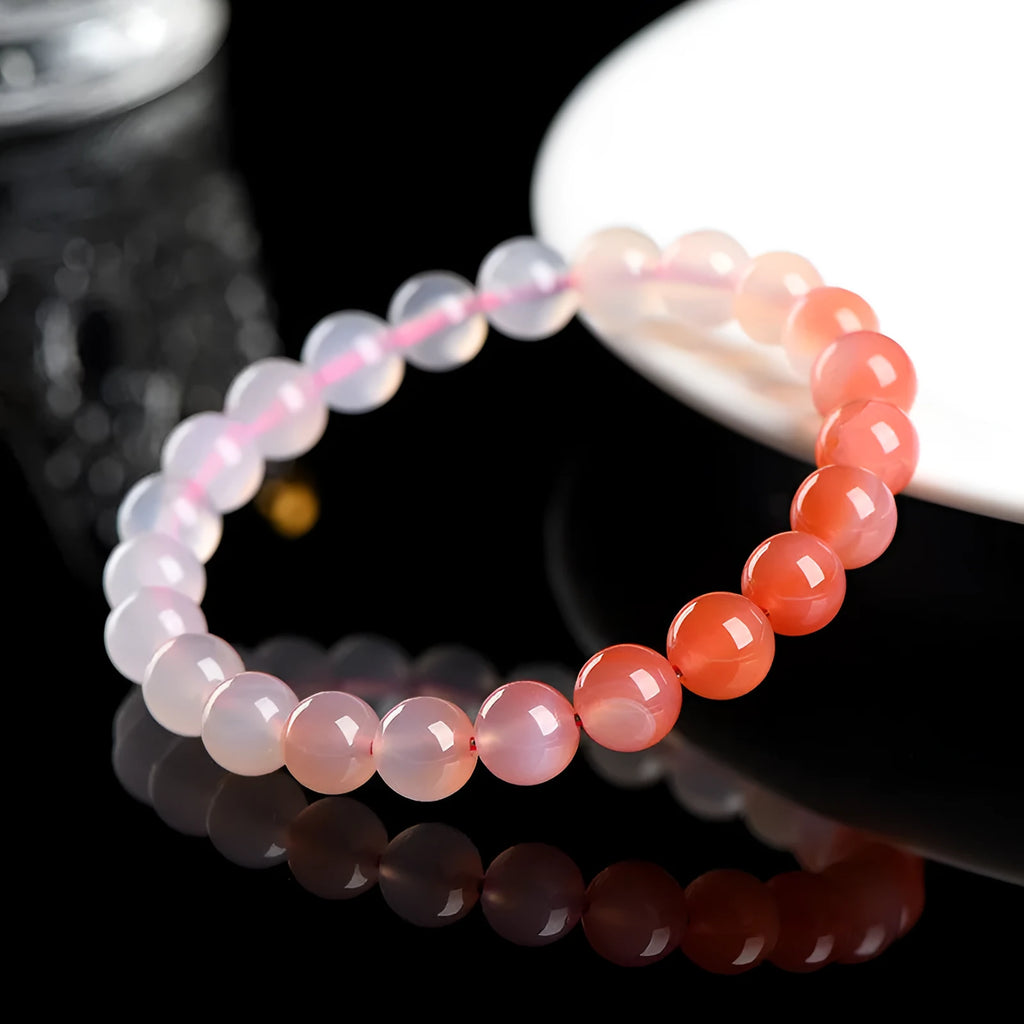Yanyuan agate bracelet with gradient colours showing beads in a geometric style on a wrist.