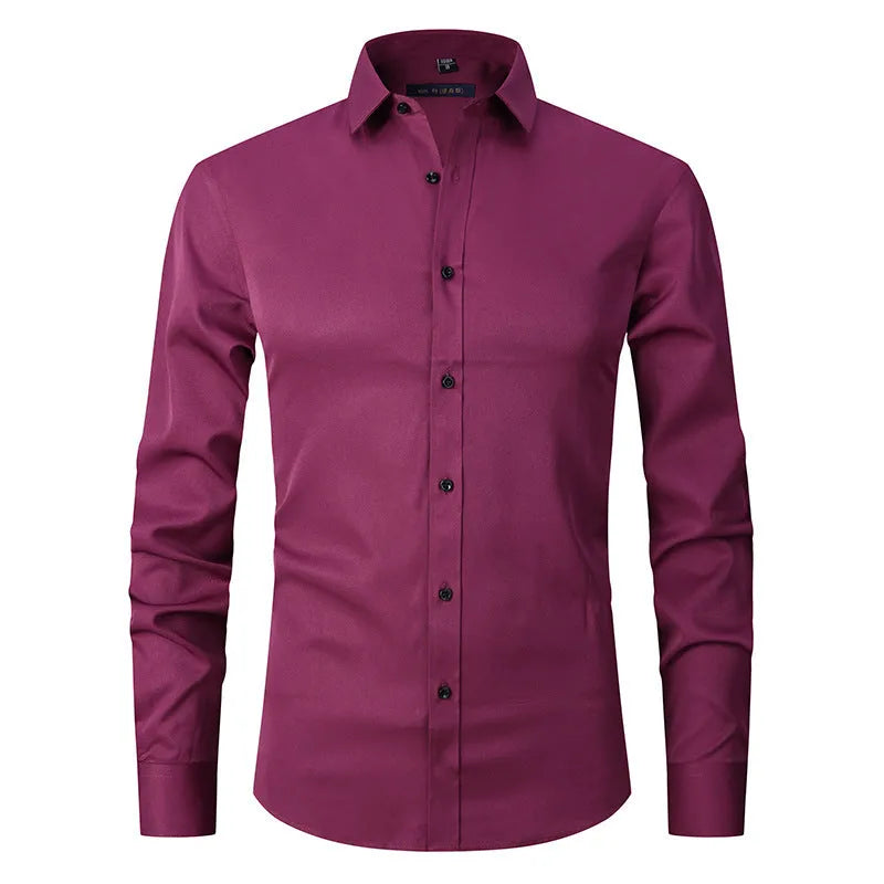 Man wearing a stretch long sleeve polyester work shirt in a solid colour, showing the fit and long sleeve design.