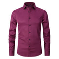 Man wearing a stretch long sleeve polyester work shirt in a solid colour, showing the fit and long sleeve design.