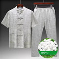 A man's traditional Chinese Tang suit in mulberry silk satin, shown in light green colour.