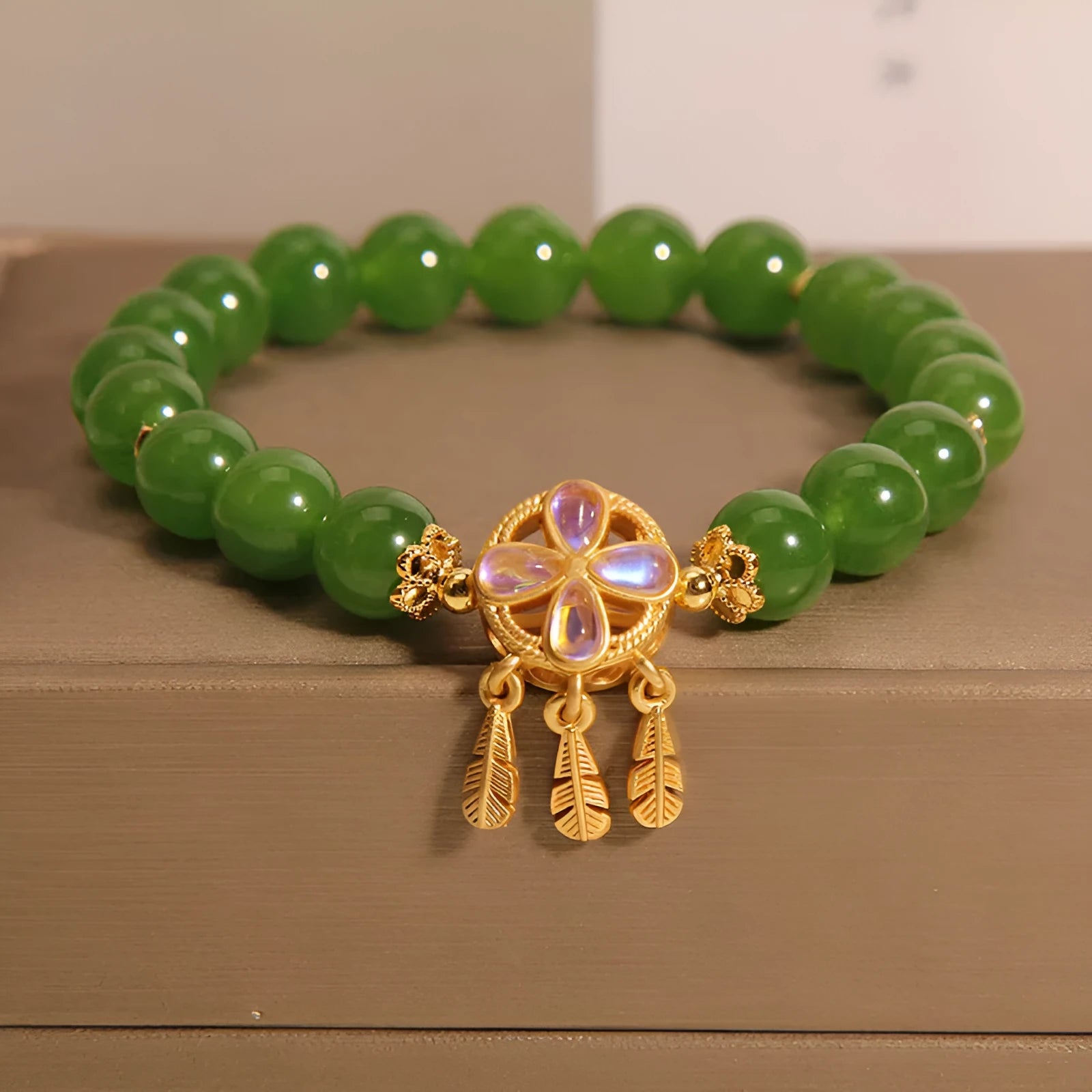 Original women's bracelet with a green jasper crystal four-leaf clover dream catcher pendant.