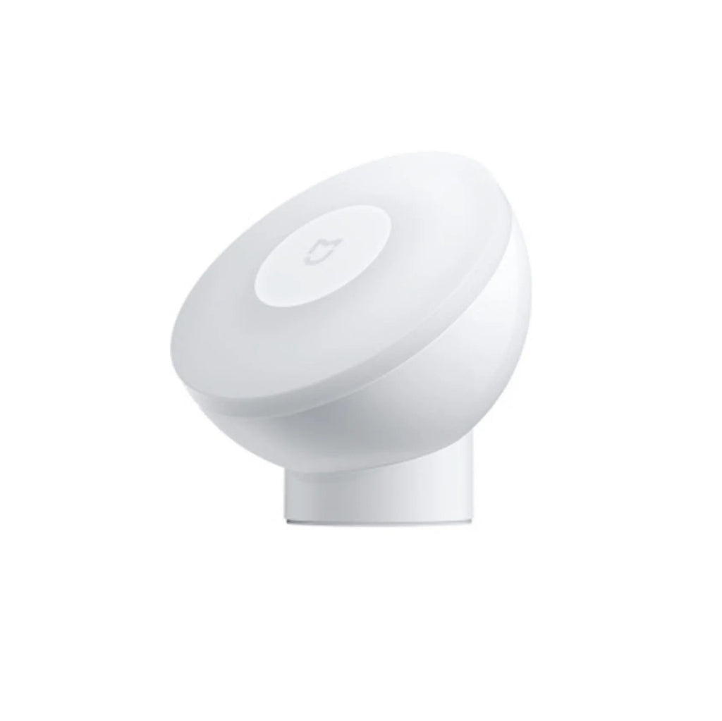 White modern Mijia induction bedside lamp with compact cubic design on a table.