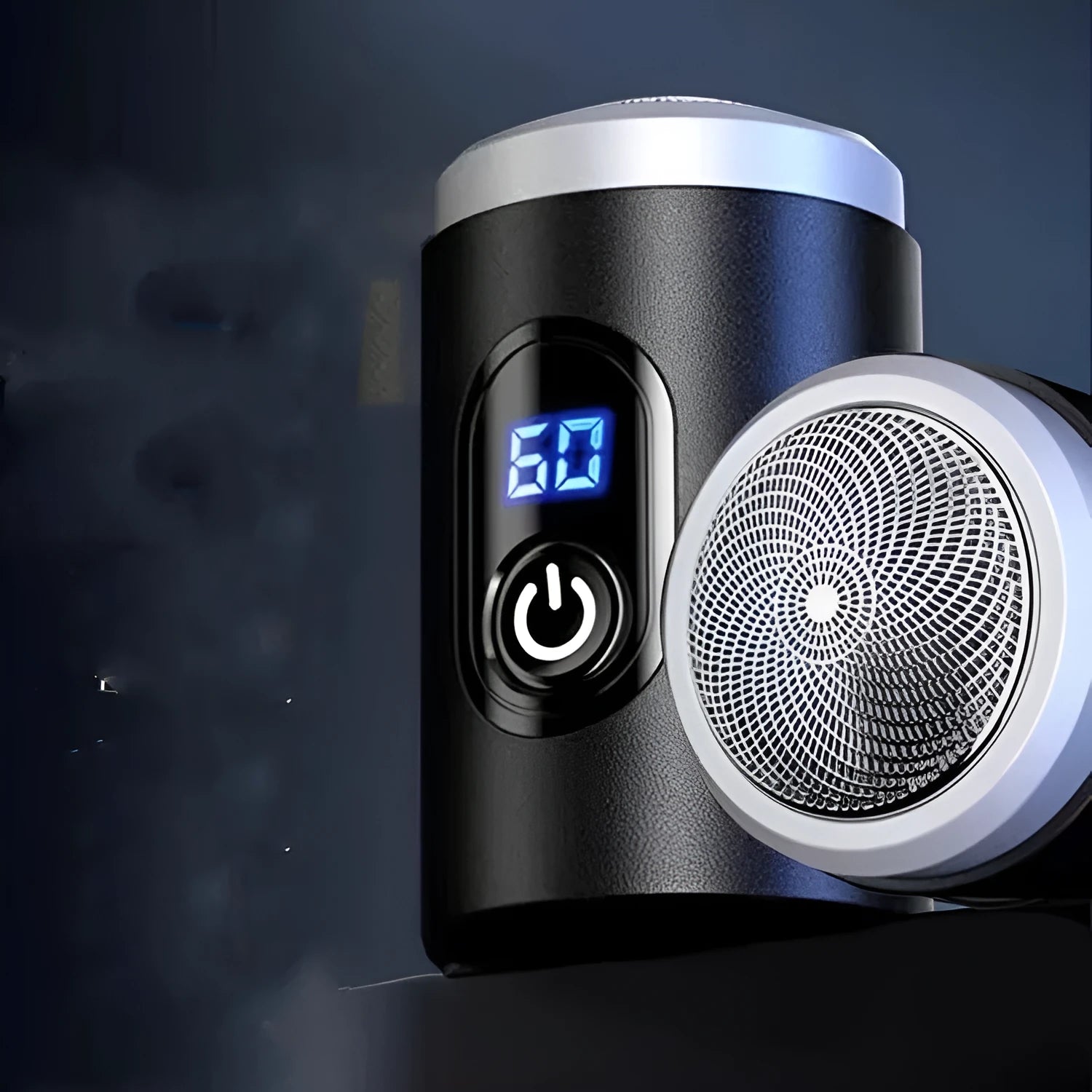 Black portable USB rechargeable shaver with cleaning brush and cable on a table.