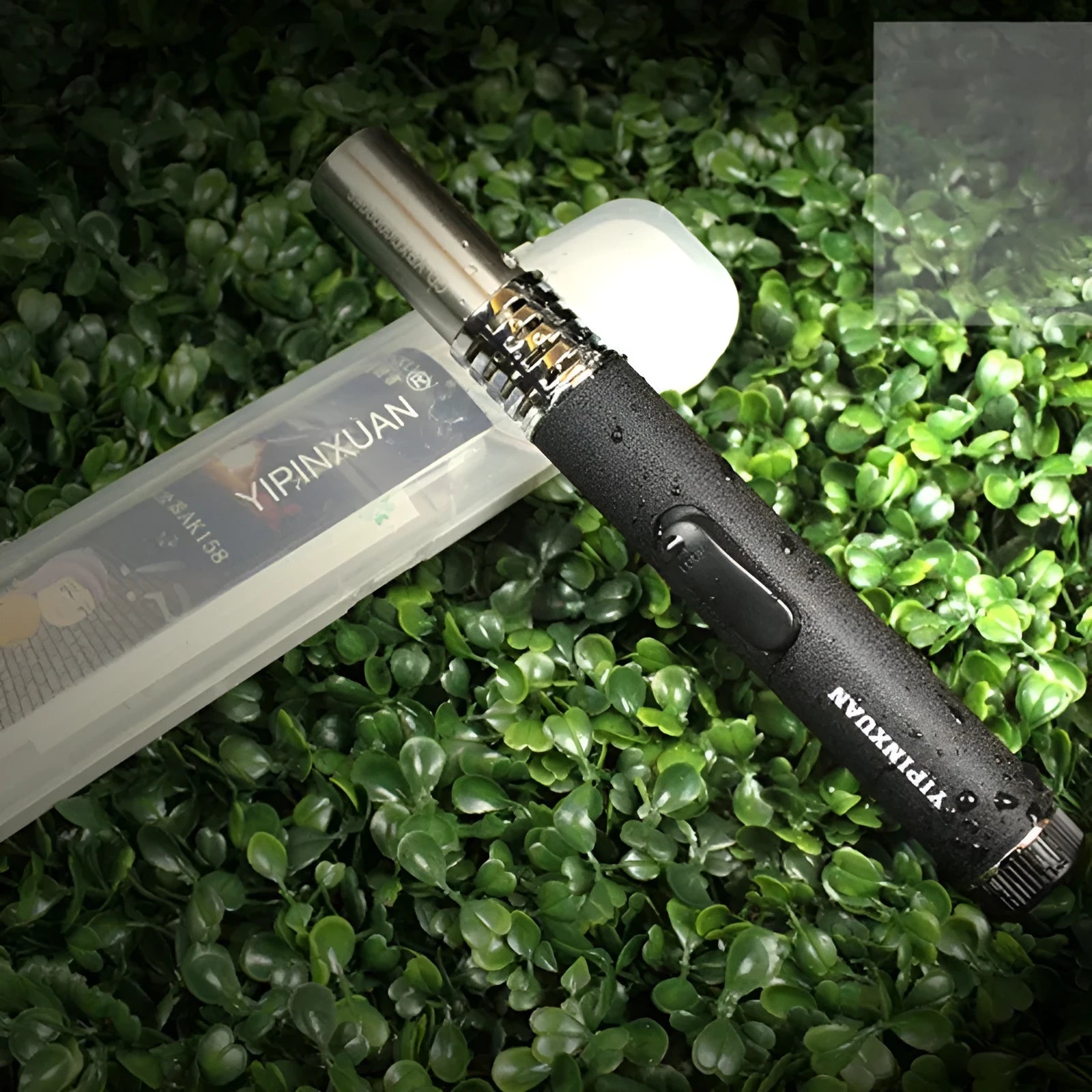 Portable metal flamethrower torch in black with child lock, 200g weight, on outdoor surface with gas bottle