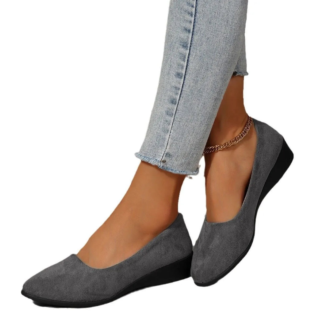 Women's light brown suede wedge pumps with a pointed toe and shallow mouth design on a rubber sole.