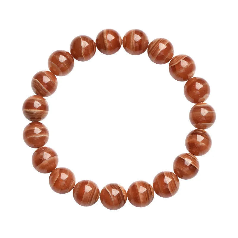 Natural pink old mine rhodochrosite round bead bracelet with a silver Ruyi charm.