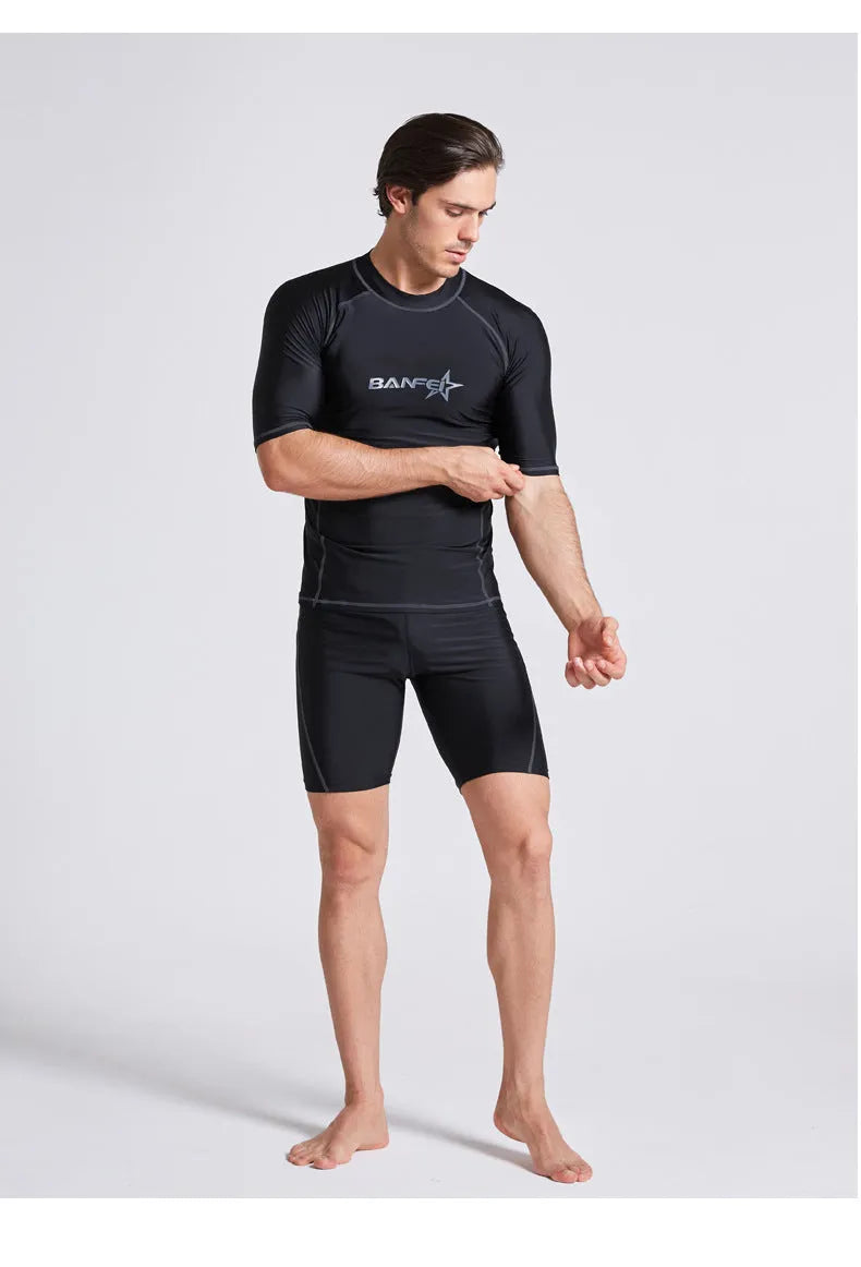 Men's half-sleeve nylon swimsuit set in blue for snorkelling and surfing with matching top and pants