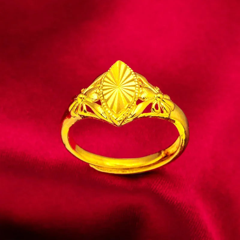 Gold open diamond flower ring with geometric floral pattern and textured brass construction