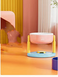 Suction cup cat bowl with adjustable lifting in pink on tile floor