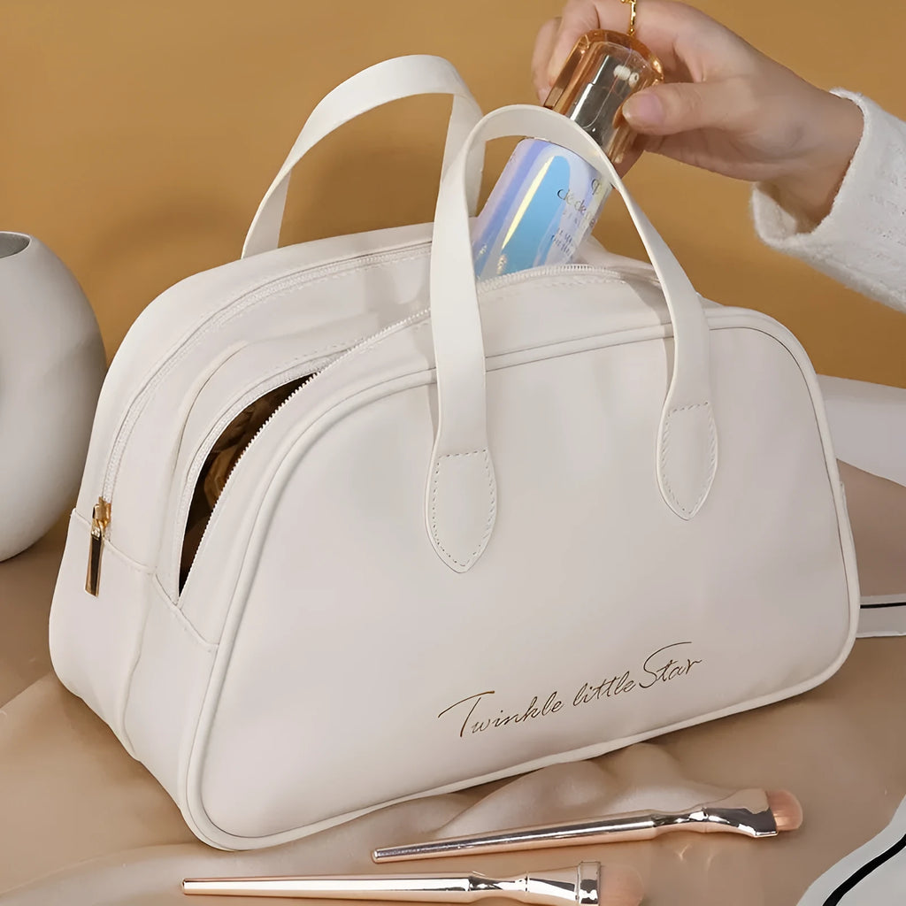Large leather-look travel toiletry bag open showing compartments, in caramel mocha colour.