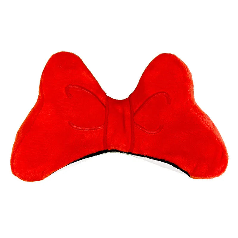 Plush velvet bow tie decoration for attaching to a motorcycle or ski helmet.