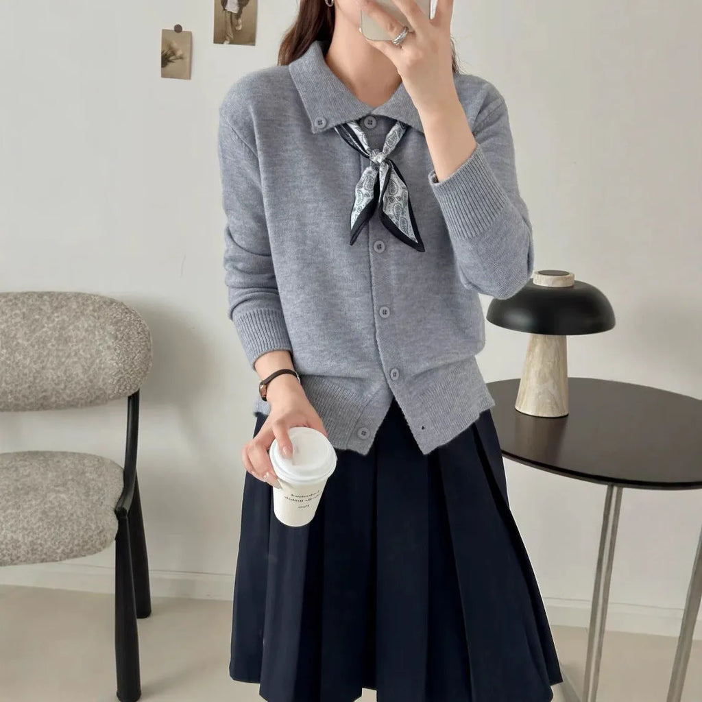 Ladies' grey lapel scarf cardigan sweater on a hanger
