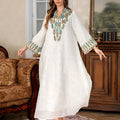 White polyester Arabic robe for women with long sleeves and long skirt.