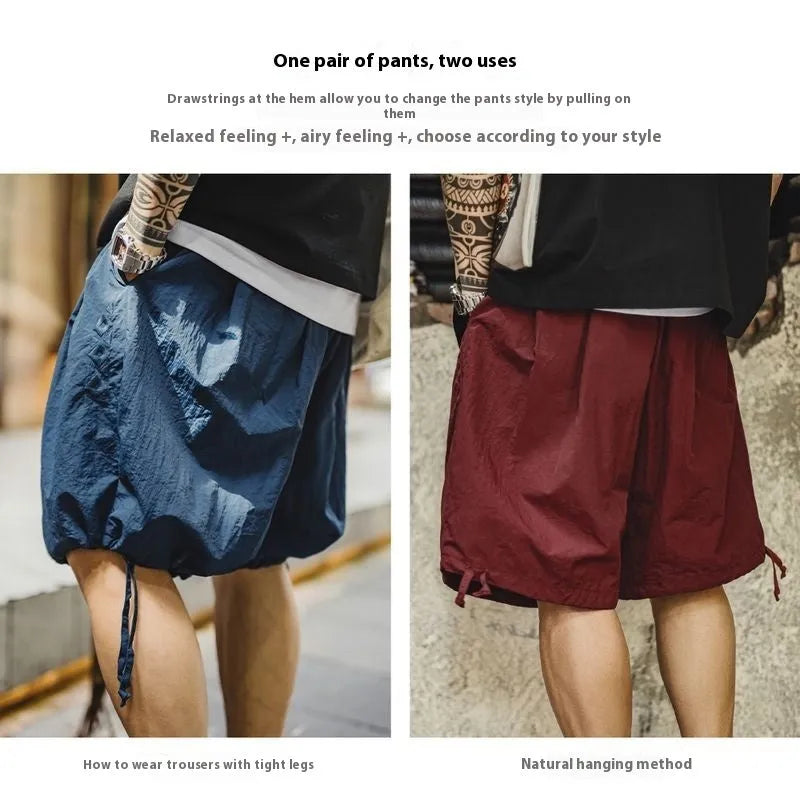 Prussian Blue men's loose beach shorts with embroidered detailing on thin nylon fabric