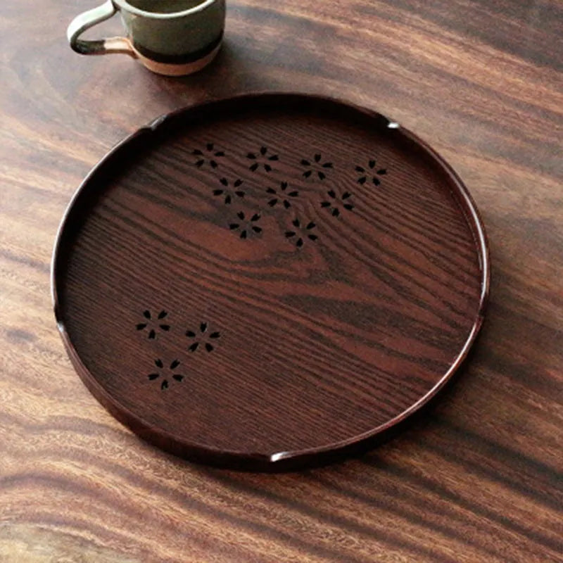 Wooden shallow plate with hollow cherry blossom design, 30cm diameter.