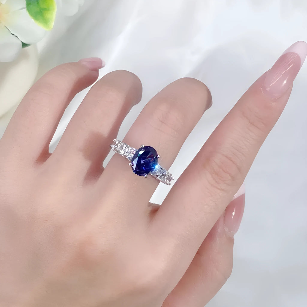 Heart-shaped sterling silver ring with an ice flower cut tan sang zircon stone on a white background.