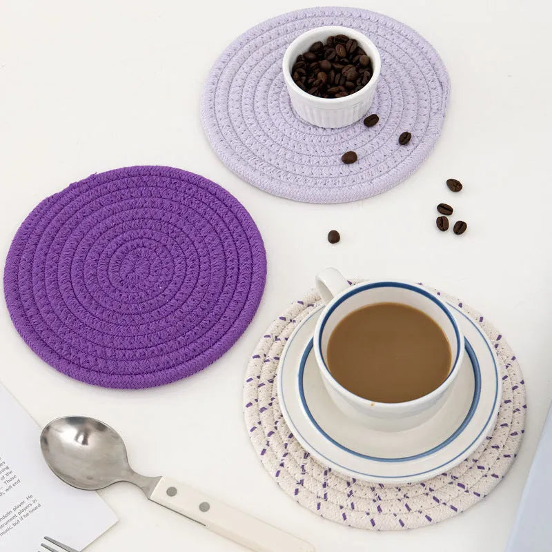 Three round cotton cord coasters in blue colour showing 18cm diameter measurement