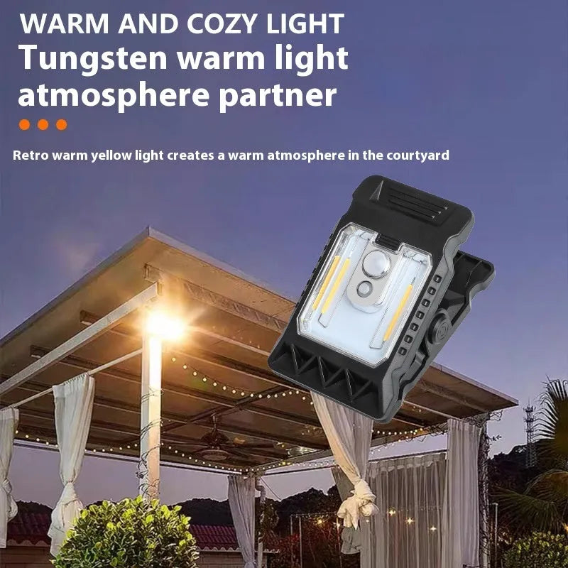 White clip lamp with motion sensor showing dimensions 11.2x7.6cm