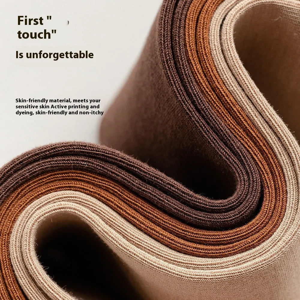 Men's solid colour mid-calf socks in combed cotton, shown in a range of neutral shades including beige, black, and dark blue.