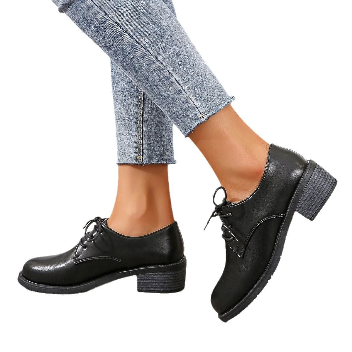 Black women's low-top shoes with a thick chunky heel and rubber sole.
