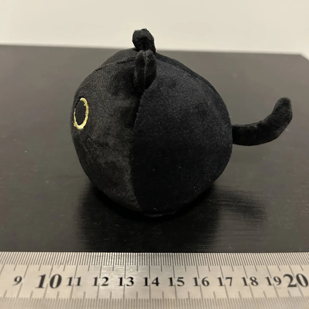 Black cat plush stuffed animal toy measuring 4 inches across