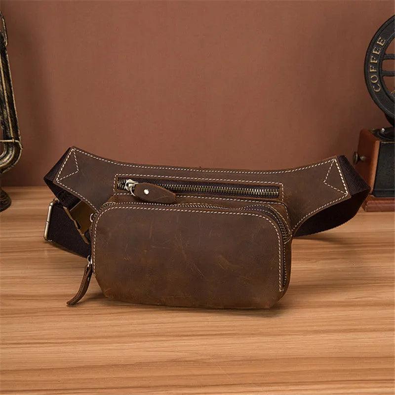 Brown cow leather men's sports waist bag with pull closure showing internal phone compartment
