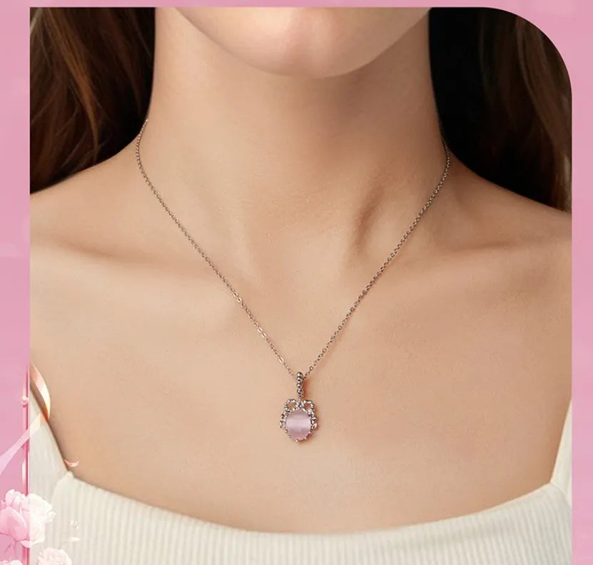 925 silver bow pendant with electroplated finish, height 2.4cm, width 1.2cm, on white background